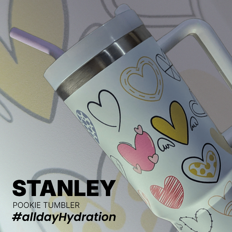 Stanley Pookie Tumbler Stanley tumbler with heart designs on a light background